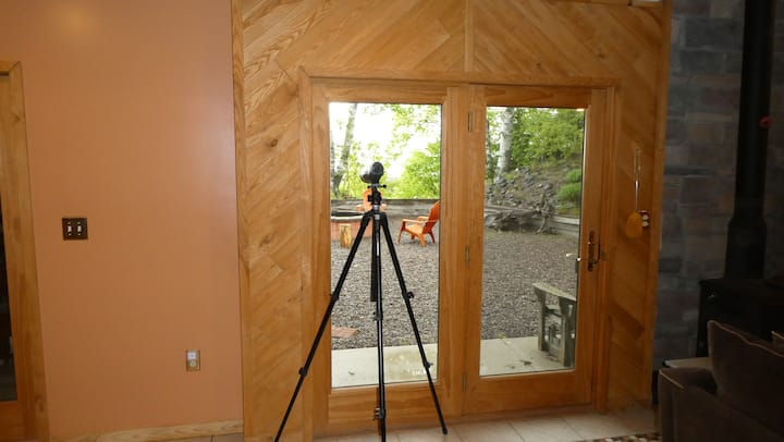 Interior room with patio doors opening to the woods