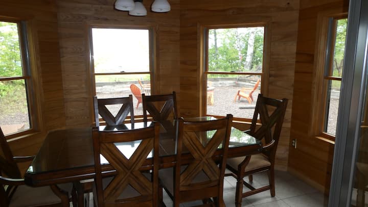 Indoor dining area surrounded by windows