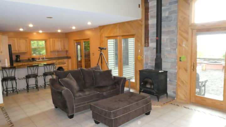 Open living room, fireplace, and kitchen