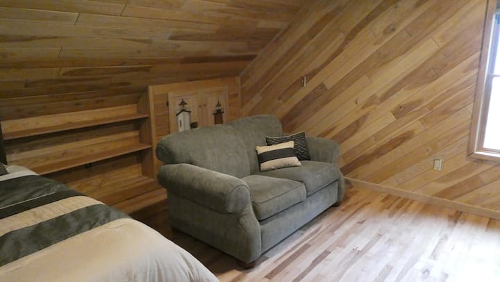 Loft sitting chair beside the sleeping area