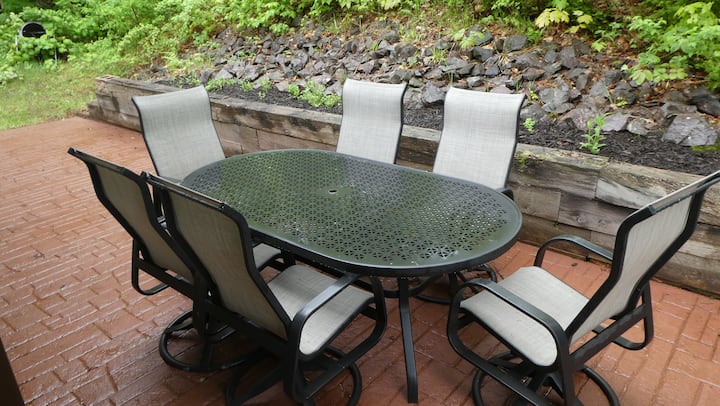 Outdoor dining table among the trees