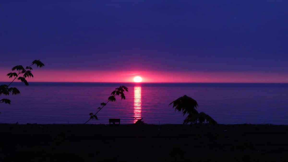 Deep pink sunset reflected across Lake Superior